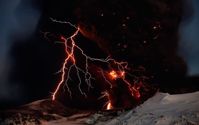 national geographic iceland volcano lightning. Lightning streaks across the